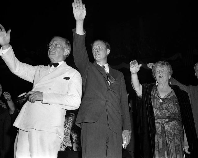 left to right senator burton k wheeler 1882 1975, charles lindbergh 1902 1974 and novelist kathleen norris 1880 1966 pledge allegiance to the american flag at an america first committee afc rally at madison square garden in new york city, 23rd may 1941  they are giving the bellamy salute, which was replaced by the hand over heart salute the following year, because of concerns about its similarity to the nazi, or fascist salute, used in italy and germany the afc was a pressure group opposed to us involvement in world war ii photo by irving habermanih imagesgetty images amf 57