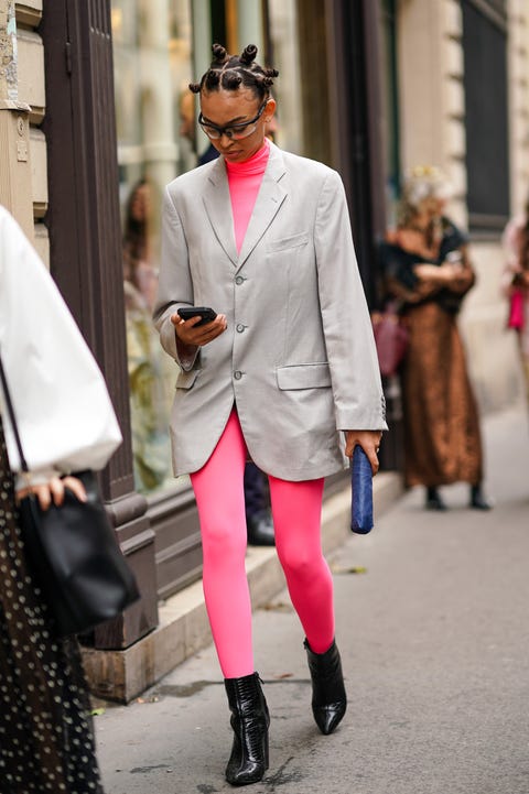 Street Style : Paris Fashion Week - Womenswear Spring Summer 2020 : Day Seven paris, france september 29 a guest wears a neon pink turtleneck, a gray oversized blazer jacket, leggings, black leather pointy shoes, outside thom browne, during paris fashion week womenswear spring summer 2020, on september 29, 2019 in paris, france photo by edward berthelotgetty images