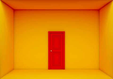 single red door closed on the yellow room