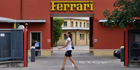a pedestrian passes the main entrance to the ferrari spa headquarters and automobile plant in maranello, italy, on tuesday, july 19, 2011 fiat spa chief executive officer sergio marchionne also said that a listing of ferrari spa, fiats most profitable unit, isnt currently on the table, while its always a possibility photographer victor sokolowiczbloomberg via getty images