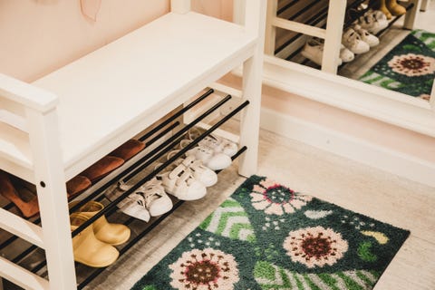 shoe rack with different size shoes showing the concept of family