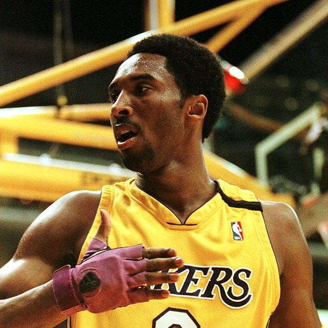 kobe bryant of the los angeles lakers gestures to fans after scoring his first basket of the season against the golden state warriors 01 december 1999 in los angeles, ca it was bryants first game of the season after recovering from a broken bone in his right hand during the pre season afp photovince bucci photo by vince bucci  afp photo by vince bucciafp via getty images