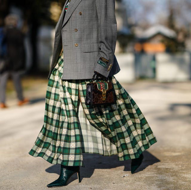 Street Style - Paris Fashion Week - Haute Couture Spring/Summer 2020 : Day Tree paris, france january 22 a guest wears a gray oversized blazer jacket, a gucci bag, a green and white checked pleated skirt, green high heeled leather boots, outside elie saab, during paris fashion week haute couture springsummer 2020, on january 22, 2020 in paris, france photo by edward berthelotgetty images