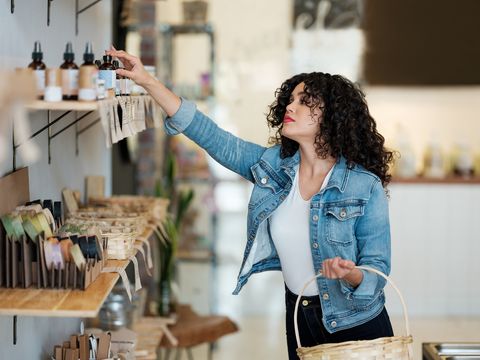 woman shops for beauty products in zero waste store