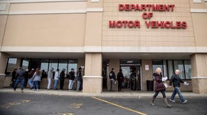 People Wait Outside a Department of Motor Vehicles Office On Long Island on January 31, 2020.