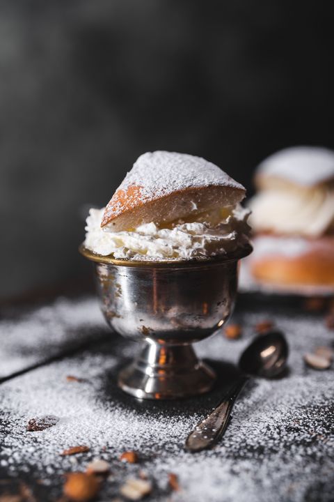 a new take on the traditional baked dessert from sweden knows as a semla, here in the form of a hot latte coffee with whipped cream on top