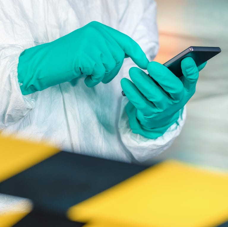 Epidemiologist using smartphone in Wuhan coronavirus quarantine