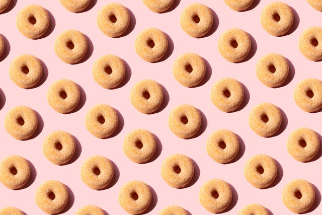 repeating donuts on a pink background