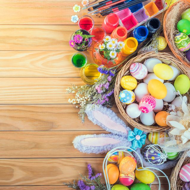 happy easter day colorful eggs and flower a set of food coloring, acrylic paintbrush for do it yourself on brown wooden floor with copy space