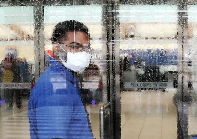baltimore, maryland   march 13 a worker at baltimorewashington international thurgood marshall airport wears a mask as he cleans a glass door as concerns for the coronavirus grow, on  march 13, 2020 in baltimore, maryland the us government is racing to make more covid 19 test kits available as schools close around the country, sporting events are canceled, and businesses encourage workers to telecommute where possible photo by mark wilsongetty images