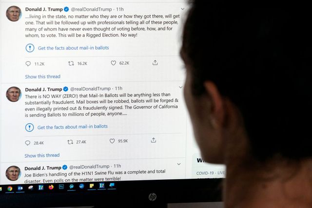 topshot   this illustration photo shows an editor in los angeles looking at the official twitter account of us president donald trump on may 26, 2020, with two tweets by the president under which twitter posted a link reading get the facts about mail in ballots   twitter labelled two of donald trumps tweets misleading on may 26, a first for the social media network which has long resisted calls to censure the us president over his frequent abuse, insults and false claims trumps tweets contended without evidence that mail in voting would lead to fraud and a rigged election photo by    afp photo by  afp via getty images