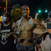 Protest for George Floyd in Charlotte charlotte, usa may 30 following the death of george floyd in minneapolis, protest in downtown charlotte turn violent in nc, united states on may 30, 2020 photo by peter zayanadolu agency via getty images