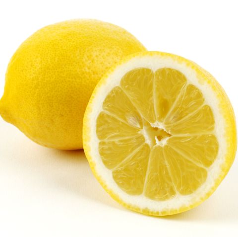 Whole and halved lemon