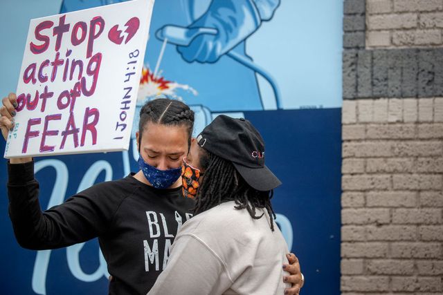 minneapolis, mn   may 26 asha knight, left, was comforted by dilonna johnson near the site where a middle aged black man died after a confrontation with minneapolis police, tuesday, my 26, 2020 in minneapolis, mn   a bystander video that started circulating sometime after the incident appeared to show the man pleading with officers that he couldnt breathe as one officer knelt on his neck photo by elizabeth floresstar tribune via getty images