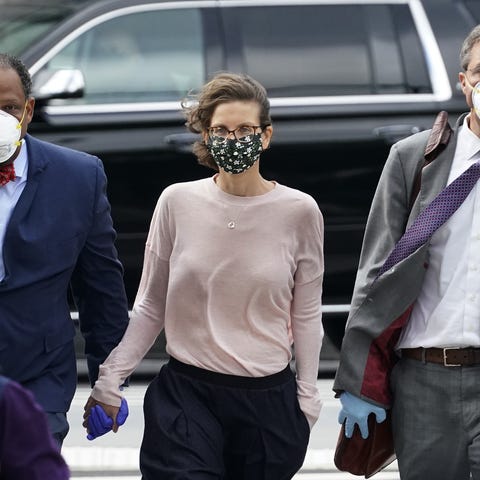 clare bronfman arrives at us district court in brooklyn, new york on september 30, 2020 to be sentenced  for her role in nxivm, a group that prosecutors say operated as a pyramid scheme and sex trafficking cult   us prosecutors on agust 28, 2020 requested life in prison for a self help guru convicted for his leadership of a cult like organization of sex slaves keith raniere, 60, was convicted on charges including racketeering and sex trafficking in june 2019, found guilty of coercing a string of women into having sex with him as the charismatic leader of a life coaching group he founded in new york state amoung them was german born american actress allison mack    known for her role in smallville    and seagram liquor company heiress clare bronfman, who was accused of using more than 100 million of her 26 billion estimated net worth to fund the group photo by timothy a clary  afp photo by timothy a claryafp via getty images