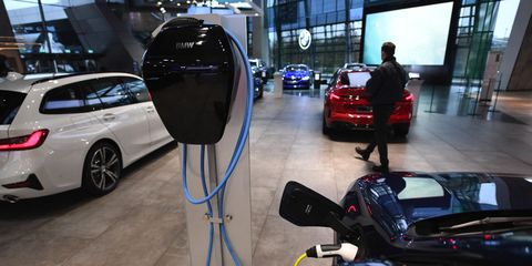 a charging station connected to a new electric bmw luxury automobile in the bmw welt automobile showroom, operated by bayermische motoren werke ag, in munich, germany, on wednesday, nov 4, 2020 bmw ended an upbeat quarter for european automakers by warning that the rapidly resurging coronavirus pandemic could wreck a sales recovery driven by strong demand in china photographer andreas gebertbloomberg via getty images