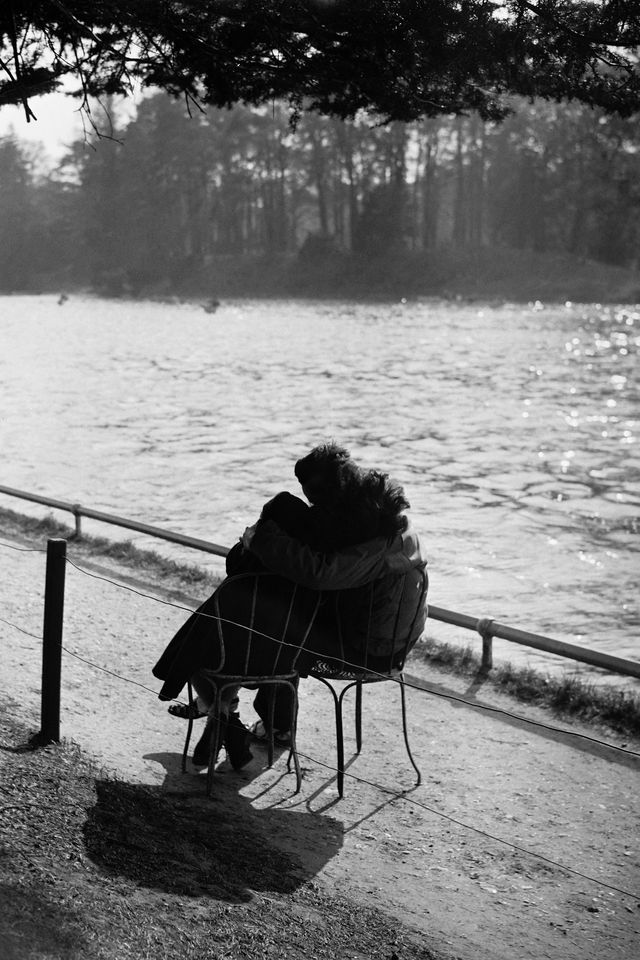 a man and a woman kiss each other while sitting near a lake in the bois de boulogne near paris, in march 1946 photo by afp photo by  afp via getty images