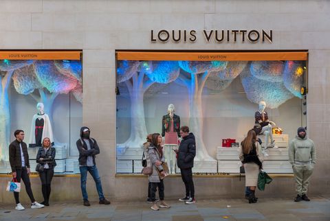 masked shoppers queuing outside the louis vuitton store in londons bond street the last day before the second national coronavirus lockdown on 4th november 2020 in london, united kingdom the new national lockdown is a huge blow to the economy and for individuals who were already struggling, as covid 19 restrictions are put in place until 2nd december across england, with all non essential businesses closed photo by barry lewisin pictures via getty images