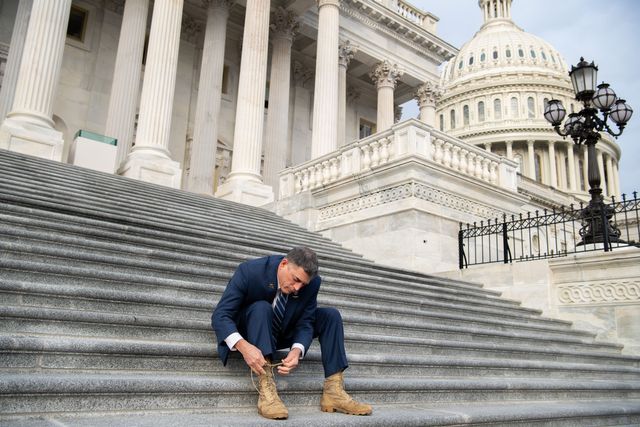 us representative andrew clyde, republican of georgia, ties his combat boots following a photograph with first term republican members of congress on the steps of the us capitol in washington, dc, january 4, 2021   donald trump and joe biden head to georgia on monday to rally their party faithful ahead of twin runoffs that will decide who controls the us senate, one day after the release of a bombshell recording of the outgoing president that rocked washingtonif democratic challengers defeat the republican incumbents in both races tuesday, the split in the upper chamber of congress will be 50 50, meaning incoming vice president kamala harris will have the deciding vote photo by saul loeb  afp photo by saul loebafp via getty images