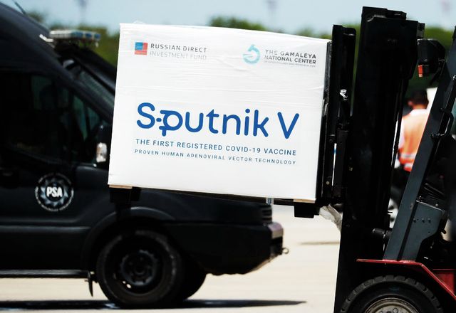 ezeiza, argentina   january 16 a container carrying part of the second batch of 300,000 doses of sputnik v vaccine is moved by a forklift after it's arrival from russia at ministro pistarini international airport on january 16, 2021 in ezeiza, argentina the 30,000 sputnik v doses of ad5 component will be applied as a second dose to the health personnel and first line workers that already received the ad26 first dose explained vice minister of health carla vizzotti photo by marcos brindiccigetty images
