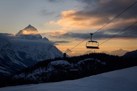 topshot   a view taken at sunrise on february 13, 2021 in cortina dampezzo, italian alps, shows a chairlift within the fis alpine world ski championships   italys health ministry on february 14 decided to keep closed ski resorts that were due to reopen on february 15, due the progression of the coronavirus variants, until march 5, 2021, the expiry date of the governments latest decree photo by fabrice coffrini  afp photo by fabrice coffriniafp via getty images