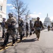 Capitol Shooting united states april 2 national guard troops in riot gear leave the scene as capitol police investigate the scene after a vehicle drove into a security barrier near the us capitol building on friday april 2, 2021 photo by bill clarkcq roll call, inc via getty images