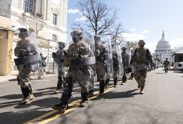 united states   april 2 national guard troops in riot gear leave the scene as capitol police investigate the scene after a vehicle drove into a security barrier near the us capitol building on friday april 2, 2021 photo by bill clarkcq roll call, inc via getty images