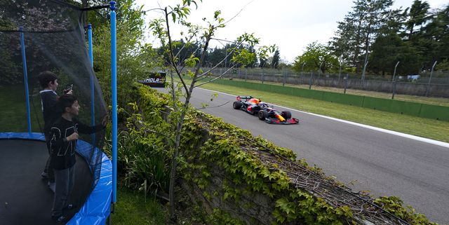 imola, italy   april 17 local residents watch the formula one cars pass by their homes during qualifying ahead of the grand prix of emilia romagna at autodromo enzo e dino ferrari on april 17, 2021 in imola, italy photo by matteo marchigetty images