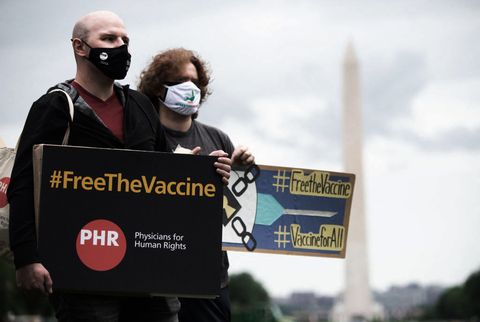demonstrators hold a rally to "free the vaccine," calling on the us to commit to a global coronavirus vaccination plan that includes sharing vaccine formulas with the world to help ensure that every nation has access to a vaccine, on the national mall in washington, dc, may 5, 2021   us president joe biden's administration announced its support for a global waiver on patent protections for covid 19 vaccines, and will negotiate the terms at the wto photo by saul loeb  afp photo by saul loebafp via getty images