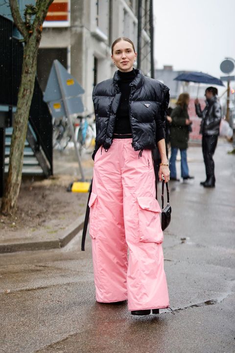 copenhagen, denmark   february 01 pernille teisbaek wearing a black turtleneck pullover, a black puffer vest by prada, oversized pastel pink pants and a black bag by prada is seen at the the garment fashion show on february 1, 2022 in copenhagen, denmark photo by streetstyleshootersgetty images