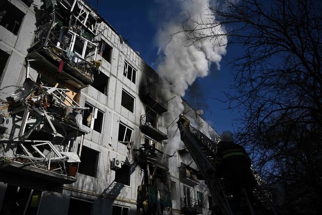 firefighters work on a fire on a building after bombings on the eastern ukraine town of chuguiv on february 24, 2022, as russian armed forces are trying to invade ukraine from several directions, using rocket systems and helicopters to attack ukrainian position in the south, the border guard service said   russias ground forces on thursday crossed into ukraine from several directions, ukraines border guard service said, hours after president vladimir putin announced the launch of a major offensive russian tanks and other heavy equipment crossed the frontier in several northern regions, as well as from the kremlin annexed peninsula of crimea in the south, the agency said photo by aris messinis  afp photo by aris messinisafp via getty images