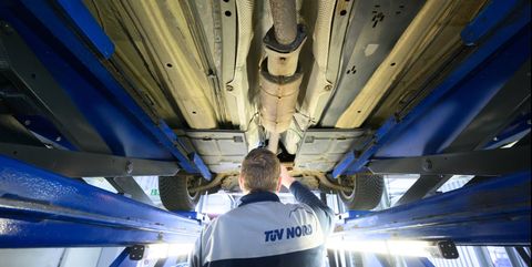30 march 2022, lower saxony, hanover an expert from tüv nord inspects a passenger car during a general inspection hu tüv nord is one of the major testing organizations in germany in addition to the well known car inspections, tüv certifies and assesses numerous technical processes and systems photo julian stratenschultedpa photo by julian stratenschultepicture alliance via getty images