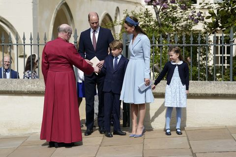 britain's prince george of cambridge shakes hands with dean of windsor, the right revd david conner l as he leaves with britain's prince william, duke of cambridge, britain's catherine, duchess of cambridge and britain's princess charlotte of cambridge r after attending the easter mattins service at st george's chapel, windsor castle on april 17, 2022 photo by andrew matthews  pool  afp photo by andrew matthewspoolafp via getty images
