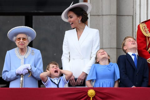 TOPSHOT-BRITAIN-ROYALS-QUEEN-JUBILEE topshot britains prince louis of cambridge 2l holds his ears as he stands next to britains queen elizabeth ii l, his m mother britains catherine, duchess of cambridge c, britains princess charlotte of cambridge 2rand britains prince george of cambridge to watch a special flypast from buckingham palace balcony following the queens birthday parade, the trooping the colour, as part of queen elizabeth iis platinum jubilee celebrations, in london on june 2, 2022 huge crowds converged on central london in bright sunshine on thursday for the start of four days of public events to mark queen elizabeth iis historic platinum jubilee, in what could be the last major public event of her long reign photo by daniel leal afp photo by daniel lealafp via getty images