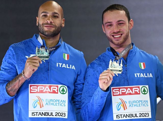 lr silver medalist italys lamont marcell jacobs l and gold medalist italys samuele ceccarelli stand on the podium for the mens 60 metres final during the european indoor athletics championships at the atakoy athletics arena in istanbul on march 5, 2023 photo by ozan kose afp photo by ozan koseafp via getty images