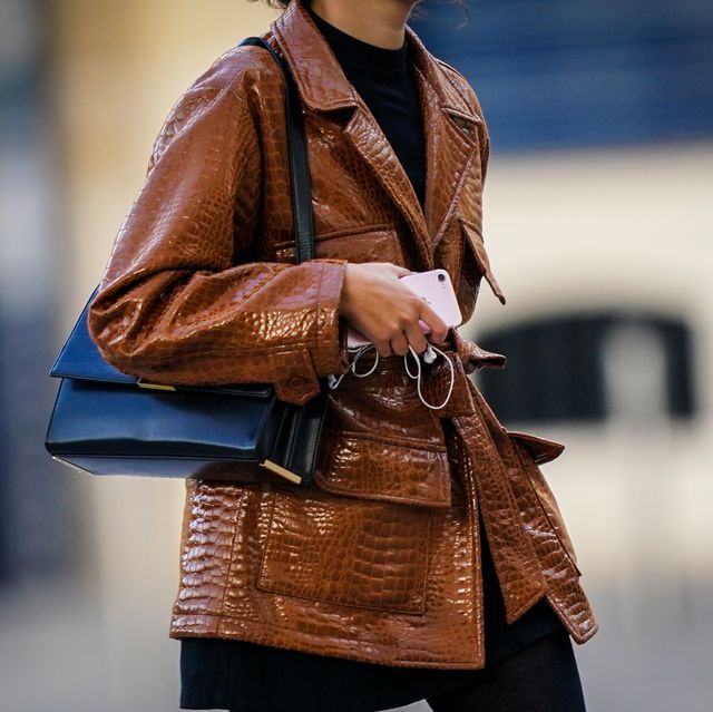 paris, france   june 08 a passerby wears a brown shiny crocodile pattern leather jacket, a black leather bag, on june 08, 2020 in paris, france photo by edward berthelotgetty images