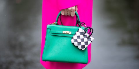 dusseldorf, germany   june 09 alexandra lapp is seen during rain wearing double breasted oversize coat from the attico in pink, green hermes kelly bag, micro bag bottega veneta on june 09, 2020 in dusseldorf, germany photo by christian vieriggetty images