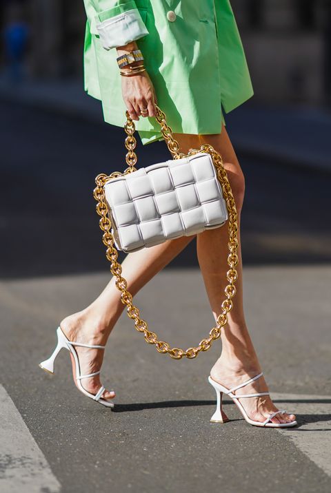 paris, france   july 12 leonie hanne wears a pale green oversized long blazer jacket from bernadette, pale green short pants from bernadette, a bottega veneta white paddedquilted woven leather bag with a golden chain, heels shoes from amina muaddi, on july 12, 2020 in paris, france photo by edward berthelotgetty images