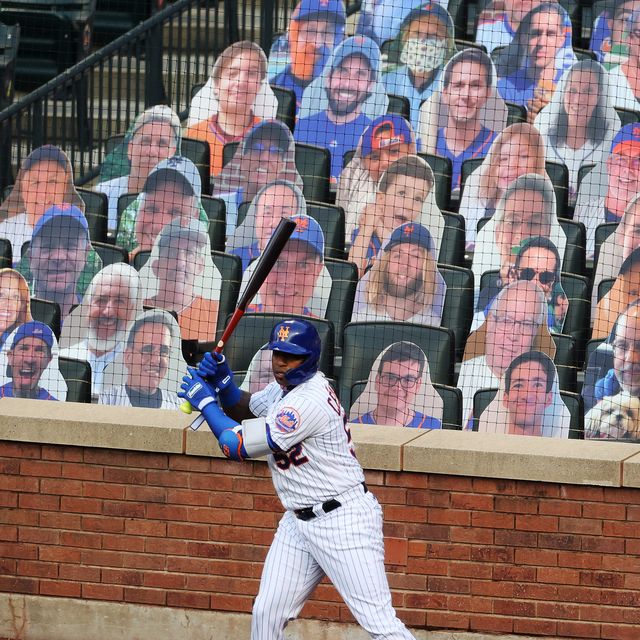 new york, new york   july 18  yoenis cespedes 52 of the new york mets stands in the on deck circle in front of cardboard fans during their pre season game at citi field on july 18, 2020 in new york city photo by al bellogetty images