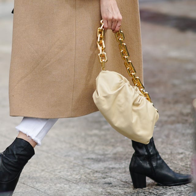 Street Style At Paris Fashion Week - Womenswear Spring Summer 2021 : Day Nine paris, france october 06 a guest wears a beige bag, a leather pouch bottega veneta bag with a golden chain, outside miu miu, during paris fashion week womenswear spring summer 2021, on october 06, 2020 in paris, france photo by edward berthelotgetty images