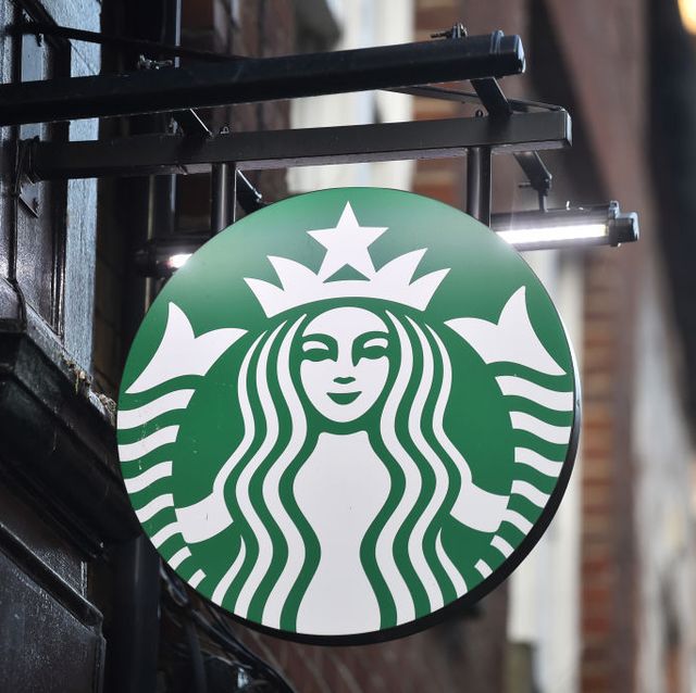 stoke on trent england   november 22 the american coffeehouse company, starbucks logo is seen outside one of its stores on november 22, 2020 in stoke on trent, england  photo by nathan stirkgetty images