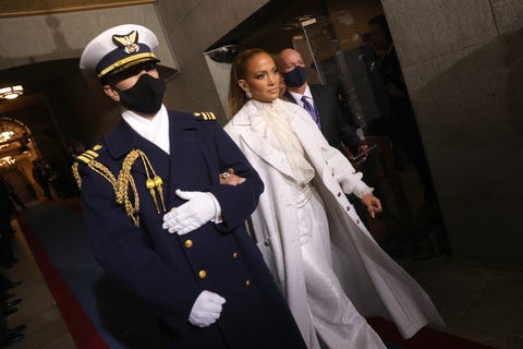 washington, dc january 20 jennifer lopez is escorted to the inauguration of us president elect joe biden on the west front of the us capitol on january 20, 2021 in washington, dc during todays inauguration ceremony joe biden becomes the 46th president of the united states photo by win mcnameegetty images