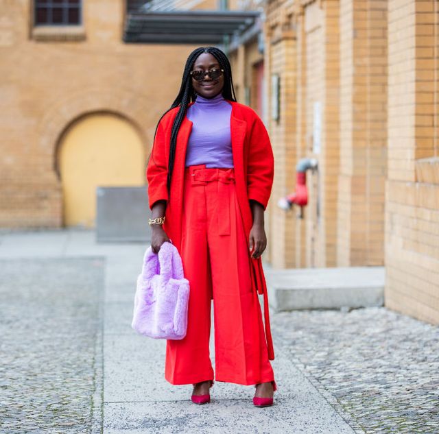 berlin, germany   january 19 lois opoku red jacket hm trend, dior shoes, asos fluffy bag in pink, dorothee schumacher turtleneck, sunglasses bottega veneta during the mercedes benz fashion week berlin january 2021 on january 19, 2021 in berlin, germany photo by christian vieriggetty images