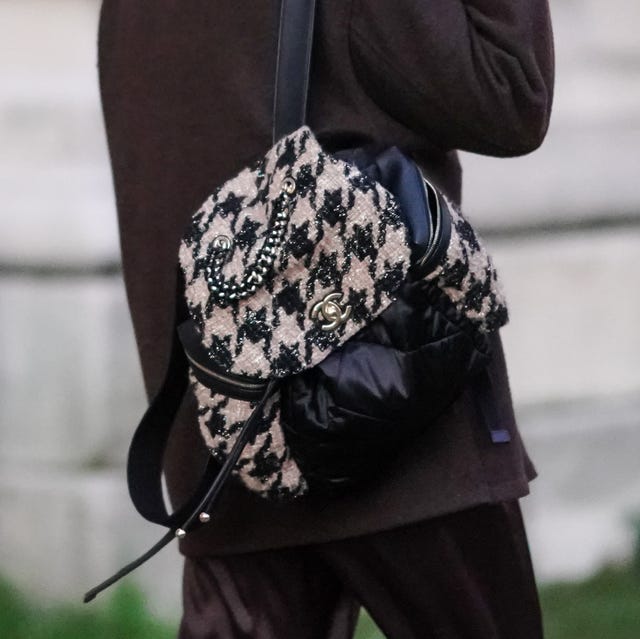 Street Style - Paris Fashion Week - Haute Couture Spring/Summer 2021 paris, france january 25 a model wears a brown jacket, a black and white houndstooth pattern tweed backpack bag with leather parts, outside the grand palais, during paris fashion week haute couture springsummer 2021, on january 25, 2021 in paris, france photo by edward berthelotgetty images