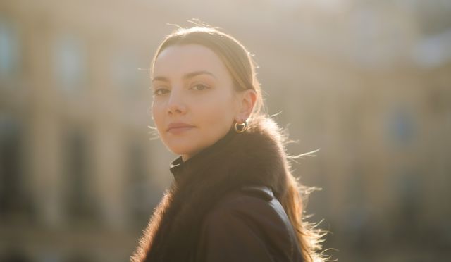 paris, france   february 10 olesya senchenko wears golden earrings, a brown leather long winter coat with fluffy collar from nour hammour, a black wool turtleneck pullover from zara, on february 10, 2021 in paris, france photo by edward berthelotgetty images