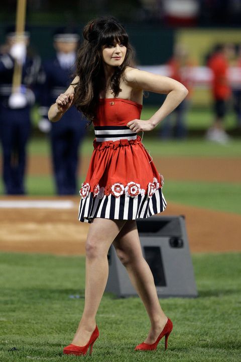 arlington, texas October 23 zooey deschanel walks on the field in front of the spangled banner prior to game four of the mlb world series between the st louis cardinals and the texas rangers at rangers ballpark in arlington on october 23, 2011 in arlington, texas photo by tony gutierrez poolgetty images
