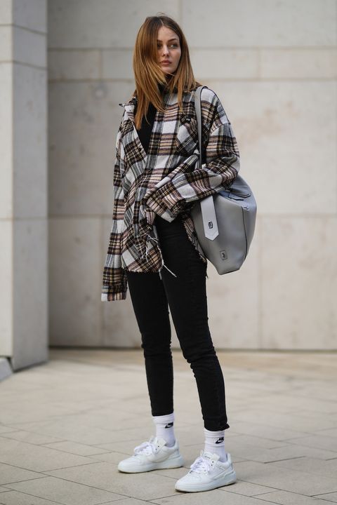 cologne, germany   march 26 vanessa stanat wearing live fast die young flanell, grey givenchy bag and white sneakers, nike socks and black hm skinny jeans on march 26, 2021 in cologne, germany photo by jeremy moellergetty images