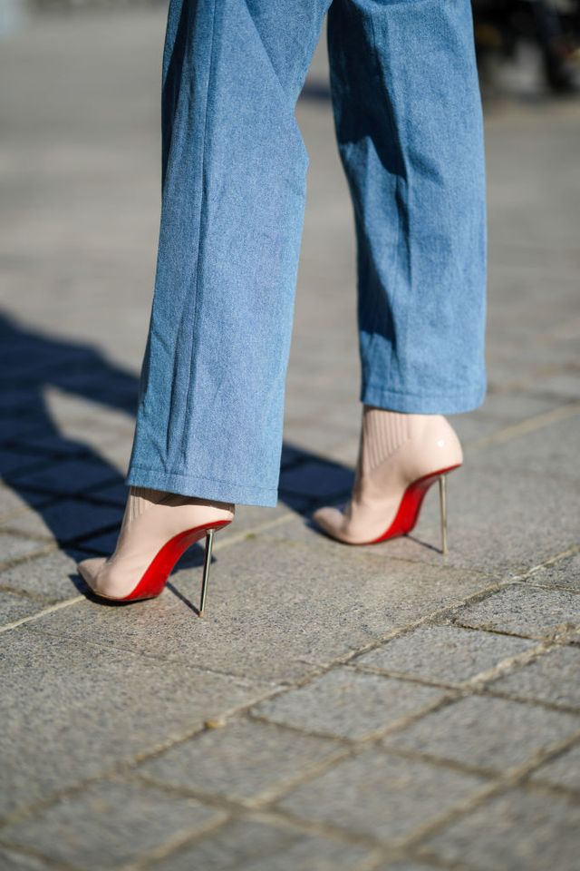 paris, france   march 30 natalia verza mascaradaparis wears a blue denim overall jumpsuit, pointed high heels shoes with red soles from louboutin, on march 30, 2021 in paris, france photo by edward berthelotgetty images