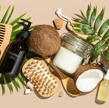 coconut oil and natural cosmetic products, hair, face and body treatment, massage and spa concept, flat lay, top view