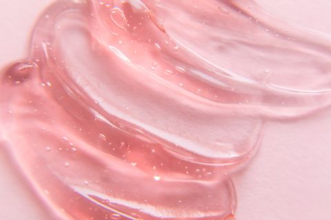 texture of gel cream liquid hyaluronic acid gel on pink background